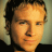 Static 48x48 pixel icon showing a close-up of a person's face with light brown hair and neutral expression against blurred background.