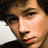 A static image with four quadrants: top-left shows a person's face, top-right displays text "Nick Jonas...", bottom-left has text "My one love<3", and bottom-right is gray.