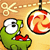Pixelated green creature with large white eyes and red mouth holds scissors above a hanging apple slice.
