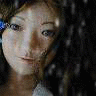 Animated sequence of a doll-like figure with brown hair and blue hair clips, showing subtle facial expression changes against a dark background with falling white particles.