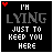 Animated pixel art displays text 'I'M LYING JUST TO KEEP YOU HERE' with a red heart in the top-left corner, cycling through variations of gray and white lettering on black background.