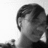 Black-and-white photo of a person with short hair on the left; teal pixelated text blocks on right and bottom reading "dayumm sooo hard to explain what went wrong but i guess it makes up for what went *right*".