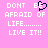 Pixelated text on pink background with heart symbol replacing 'BE' in phrase.