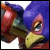 Pixelated cartoon character with blue hair, red cheeks, and a yellow beak-like mouth against a blue background.