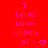 Red background with pink text reading 'I Love Luke Wilson =]' and a heart symbol, displayed in two identical side-by-side