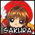 Pixelated static icon of a chibi-style character with red hair and brown eyes, wearing a large red hat, with visible text below the face.