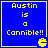 Blue square with yellow border containing pixelated text 'Austin is a Cannible!!' and small Pac-Man icon in bottom-right corner.