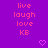 Purple background with repeated pink text 'live laugh love KB' and small pixelated hearts in a pattern