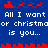 Blue background with red pixelated reindeer and sleigh icons above white text reading "All I want or christmaoor christmas is you..." in two mirrored sections.