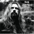 Black-and-white grayscale image of a person with long hair and beard overlaid on red text reading "Foxy IT Whats Ganna Be" against black background.