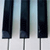 Three vertical dark blue bars with light gray stems on a light blue and white gradient background, each bar containing faint pixelated text.