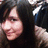 A person with long dark hair and a light-colored fur-trimmed garment appears in three showing slight head movement