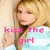A pixelated image of a blonde woman in a light blue top with pink text reading 'kiss the girl' and a small pink heart symbol.