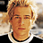 Pixelated image of a person with light hair and dark clothing on red background, accompanied by text reading "who ever" and "this guy ishe's cute!"