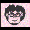 Pixelated cartoon head with dark curly hair, glasses, and a smile on a pink dotted background, with two text variations below.