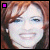 A 6-frame animated contact sheet showing a woman with red hair and blue eyes in various facial expressions, each frame featuring small colored squares in the top-left corner that change position across frames.