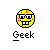 Pixelated yellow circular face with blue eyes, black glasses, red spots, and a wide grin showing two front teeth on gray background.