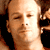 Static 50x50 pixel icon showing a close-up of a person's face with light skin tone, visible facial features including eyes and nose, and dark hair on the sides against a black background.