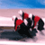 Static pixelated icon of a red and black object resembling a sports helmet or vehicle with blue sky background, likely representing a sports theme.