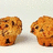 Two pixelated muffins on a white background with blue text stating 'theres 2 muffins in an oven then the other one says ier one says "its gettin"HOLY SHIT not in here A TALKING MUFFIN!'