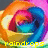 A colorful, pixelated rose with swirling rainbow hues of orange, blue, pink, and yellow on a gradient background.