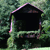 A pixelated icon shows a dark house shape with a pink outline against a green pixelated background.