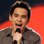 A pixelated image shows a person holding a microphone against a red and dark background, with blue text reading "I <3 DAVID VOTE 4 HIM" on the right.