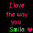 Pixelated text and heart symbols on black background, with pink 'I love the way you Smile' text and green 'Smile' text. Two variations show different heart colors.