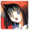 Pixelated image of a character with dark hair and light skin wearing a red garment, set against an orange background.