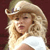 Pixelated image of a person with long blonde hair wearing a light-colored cowboy hat and white top against a dark red background.