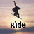 Pixelated image of a dark silhouette figure in mid-air pose against gradient sky background with 'Ride' text below.