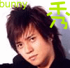 A person with brown hair and a black top appears in three , each showing slight variations in head position and facial expression