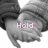 A grayscale image of two hands holding each other, with pink text reading "Hold my Hand" across the frames.