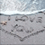 Beach scene with 'I LOVE' text and heart drawn in sand, two starfish on left side, ocean waves at top.