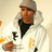 A pixelated image of a person in a white hoodie and gray cap holding an object, with green background text reading "I got Lubbie Dubbie!!" below.