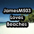 Beach scene with blue sky, green trees, and white sand background overlaid by three black text boxes reading 'JamesM503', 'Loves', and 'Beaches' in pixelated font.