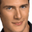 A pixelated orange and white graphic featuring a partial portrait of a person, text reading 'Living with Fran', 'Premieres April 8th', and a stylized 'WB' logo.