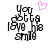 Pixelated text "You got to love the smile" in black with a pink heart above, displayed on white background.