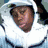 Four distinct pixelated portraits of a person in different outfits and poses arranged in a