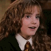 A young woman with long curly brown hair wears a dark green robe over a white collared shirt and brown striped tie, shown in three sequential expressions.