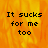 Pixelated text "It sucks for me too" on a fiery orange-yellow background with one gray