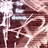 Pixelated static image with abstract brown and white shapes, no discernible subjects or text.