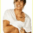 A pixelated image of a person in a white shirt with arms crossed, alongside green pixelated text on black and gray backgrounds.