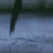 Static pixelated icon showing a dark vertical shape against a gradient background with no visible text or distinct subjects.