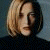 Pixelated image of a person with short blonde hair wearing dark clothing against a gradient background, next to green text reading 'Original Icons .com' on solid green.