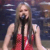 A pixelated contact sheet showing two frames of an animated icon featuring a woman in a red dress singing into a microphone on the left and bold black text "AVRIL" on a solid pink background on the right.
