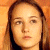 Static image shows a person with long brown hair against an orange background, next to green text reading "Original Icons .com" on dark green.