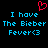 Black background with blue pixelated text reading "I have The Bieber Fever<3" and a red pixelated heart symbol above the text.