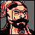 Pixelated static icon of a bearded man with glasses and long hair, rendered in pinkish-orange tones against a gray background.
