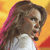 A pixelated close-up of a person with long brown hair and a white top against a gradient background of yellow, orange, and red hues.